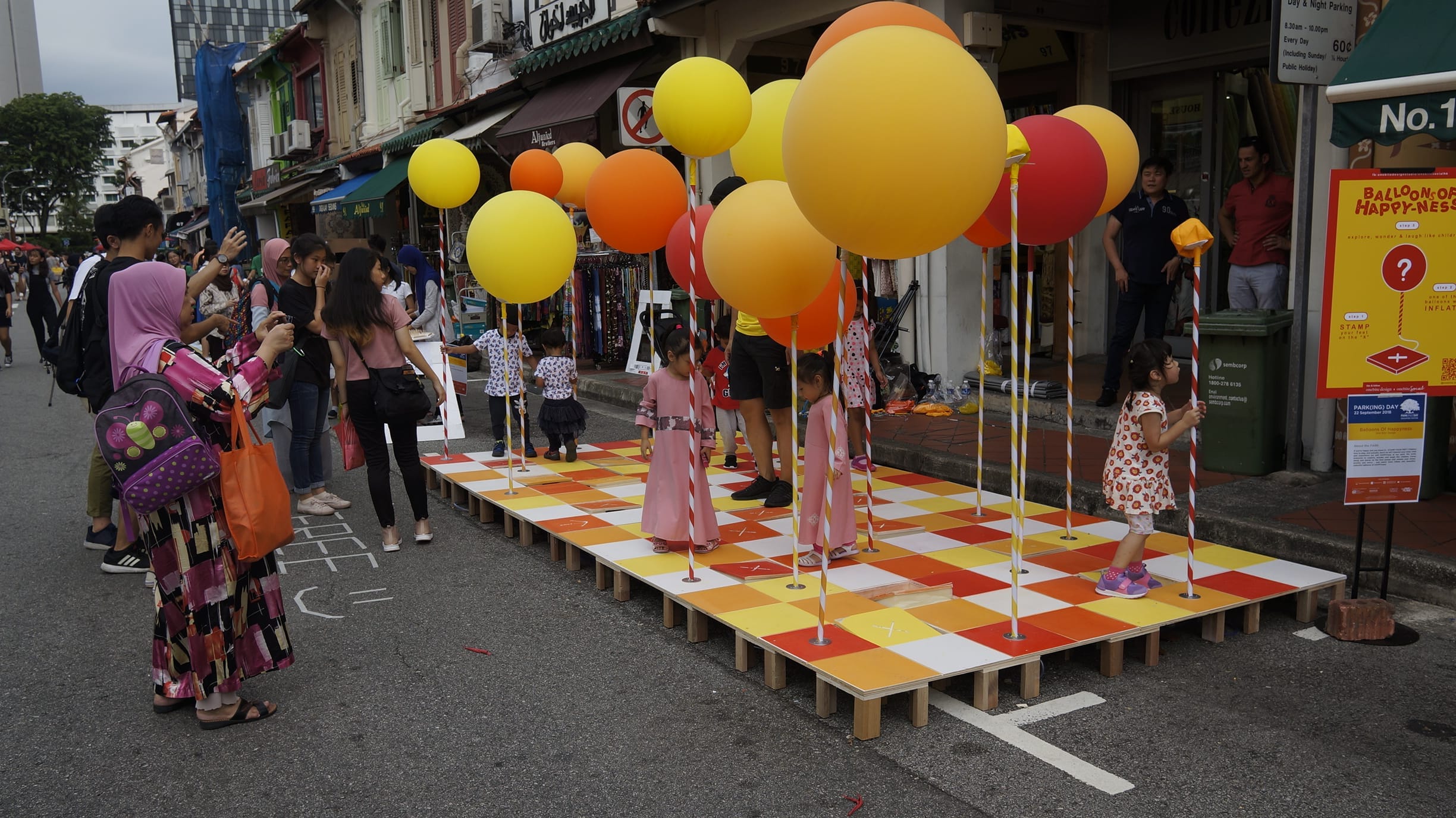 Photo of vibrant activities at road closure at PARK(ing) Day